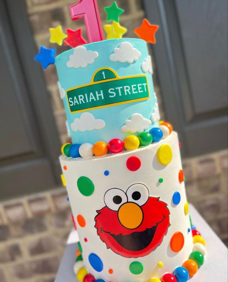 a sesame street birthday cake with the number one on it