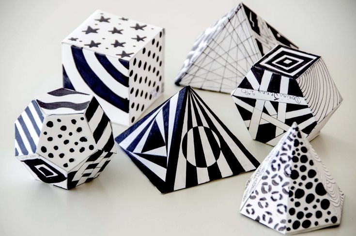 several black and white geometrically designed objects