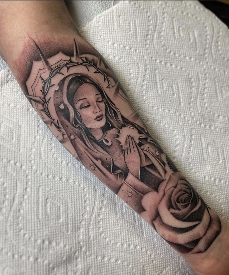 a woman's arm with a tattoo on it and a rose in the middle