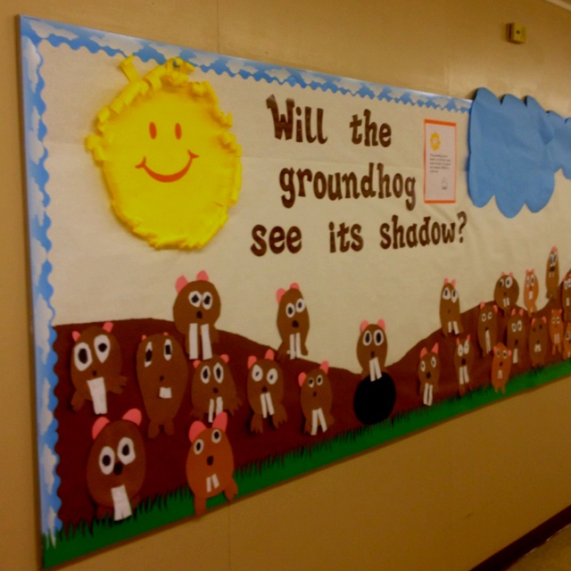 a bulletin board that says will the groundhog see its shadow? with farm animals on it