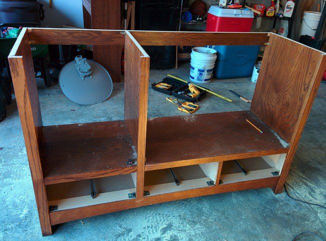 an unfinished entertainment center in the process of being built