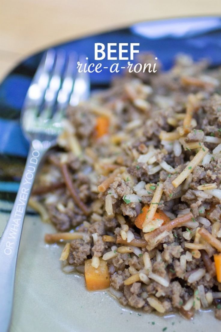 a close up of a plate of food with rice and carrots on the side