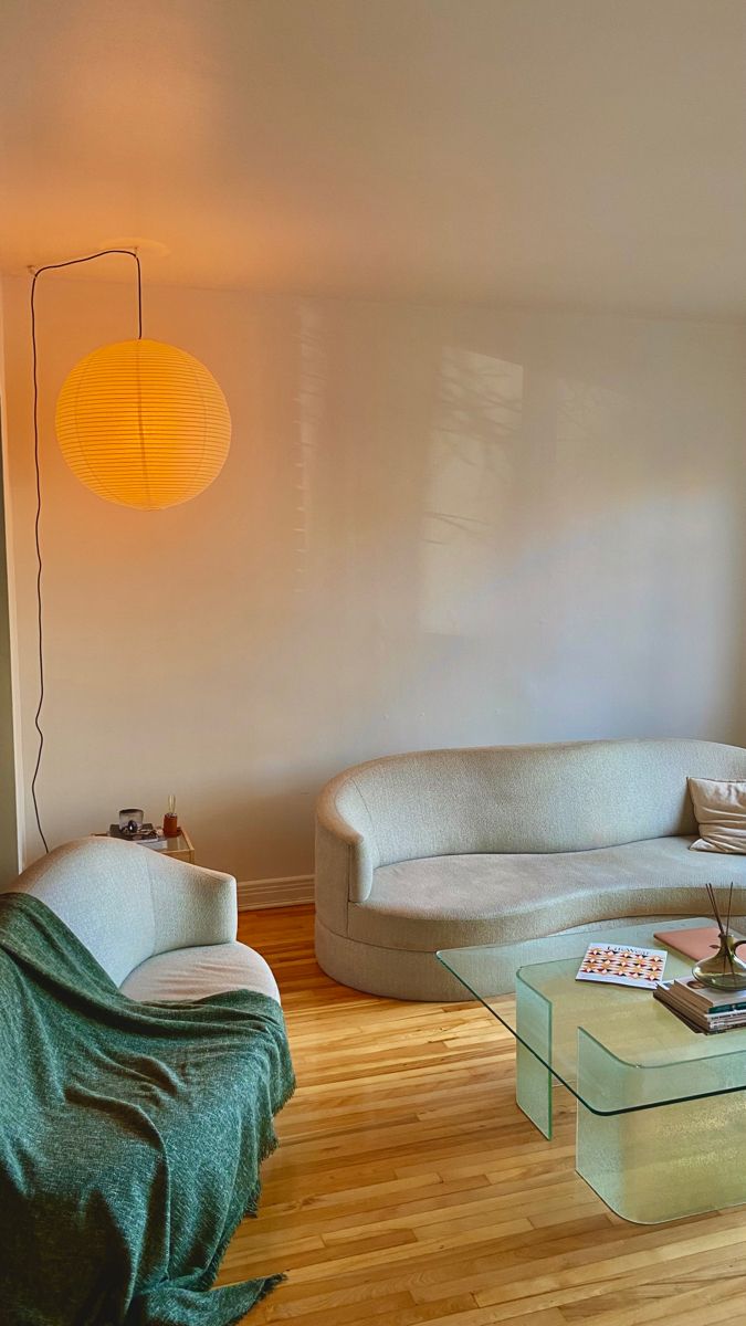 a living room filled with furniture and a lamp