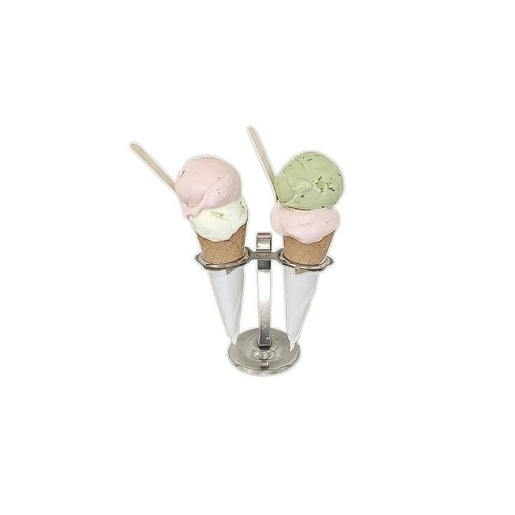 two ice cream cones sitting on top of each other in front of a white background