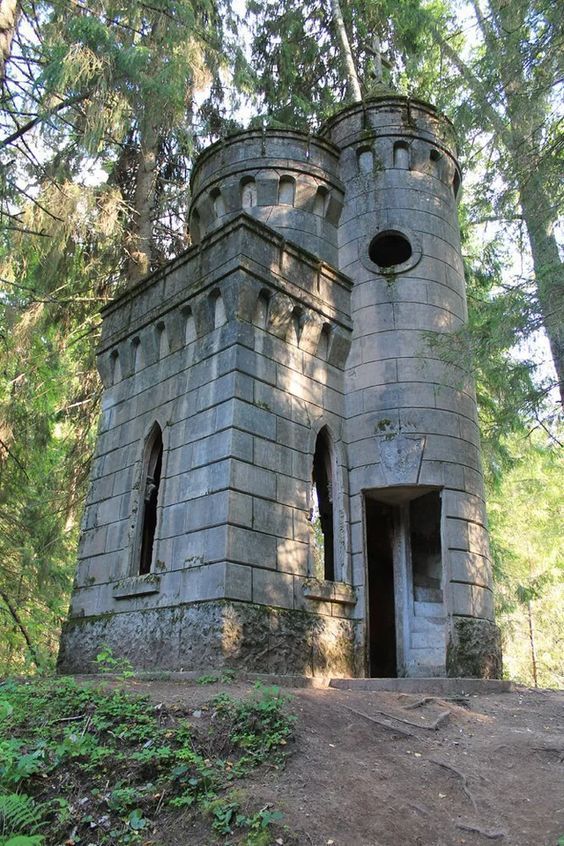 an old castle like structure in the woods