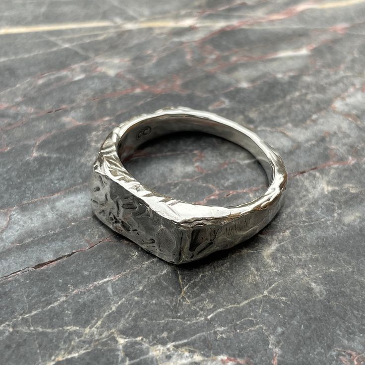 This beautifully textured, rugged version of our Small Rectangle Signet Ring is ready for anything life throws at it. The face of this signet is a perfect blank canvas upon which to add your personal touch, designed to accomodate up to three hand-stamped letters or numbers. These timeless signet rings are meticulously crafted by hand in our Melbourne workshop, created out of wax and then cast into precious metal. Made with the highest quality Australian sterling silver to last forever. Made soli Signet Ring Silver, Custom Handmade Silver Signet Ring, Silver Oxidized Finish Signet Ring As Gift, Gift Signet Ring With Oxidized Finish, Vintage Silver Hand Forged Signet Ring, Hand-cast Silver Signet Ring, Silver Signet Ring, Artisan Earrings, How To Make Rings