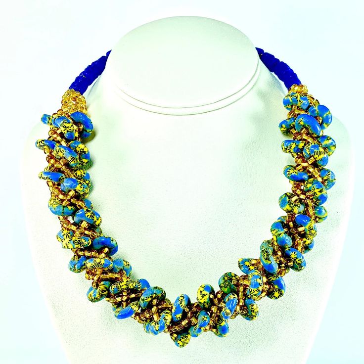 The simple elegance of the Harmony necklace in Deep Blue is the perfect accessory to upscale a look during the day, or to add a touch of elegance and glamour to you look at night. Its a necklace with a fun mix of colours that give off a sense of playful elegance and style your casual or business look needs. Created with a tasteful mix of fresh colours, these bright coloured necklaces are complimented with a pair of earrings and bracelet which can be worn together or separately.  Some of these ne Elegant Adjustable Blue Crystal Necklace, Elegant Blue Crystal Necklaces For Parties, Elegant Blue Crystal Necklace For Party, Elegant Blue Crystal Necklaces With Round Beads, Elegant Blue Crystal Necklace With Round Beads, Elegant Blue Necklace With Round Beads, Blue Beaded Necklaces For Evening, Long Necklace With Colorful Beads For Party, Blue Long Necklace For Party