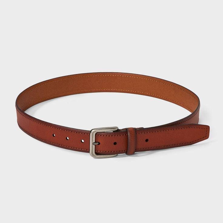 Complete your outfit in sleek style with this Leather Dress Belt from Goodfellow & Co™. This tan medium belt is made from 100% flat leather material for a comfortable and classic look. It also has a shiny silver buckle closure to complete the classy look and allows you to get a customized fit with multiple holes and loop. Pair with any of your pants to feel great all day. Goodfellow & Co™: Where style & fit are always in good company. Classic Leather Belts For Fall, Classic Leather Belt For Fall, Classic Brown Belts For Business Casual, Classic Brown Belt For Business Casual, Leather Belts For Formal Fall Occasions, Brown Fitted Leather Belt, Fitted Brown Leather Belt, Formal Leather Belts For Fall, Brown Belt With Self Belt For Workwear