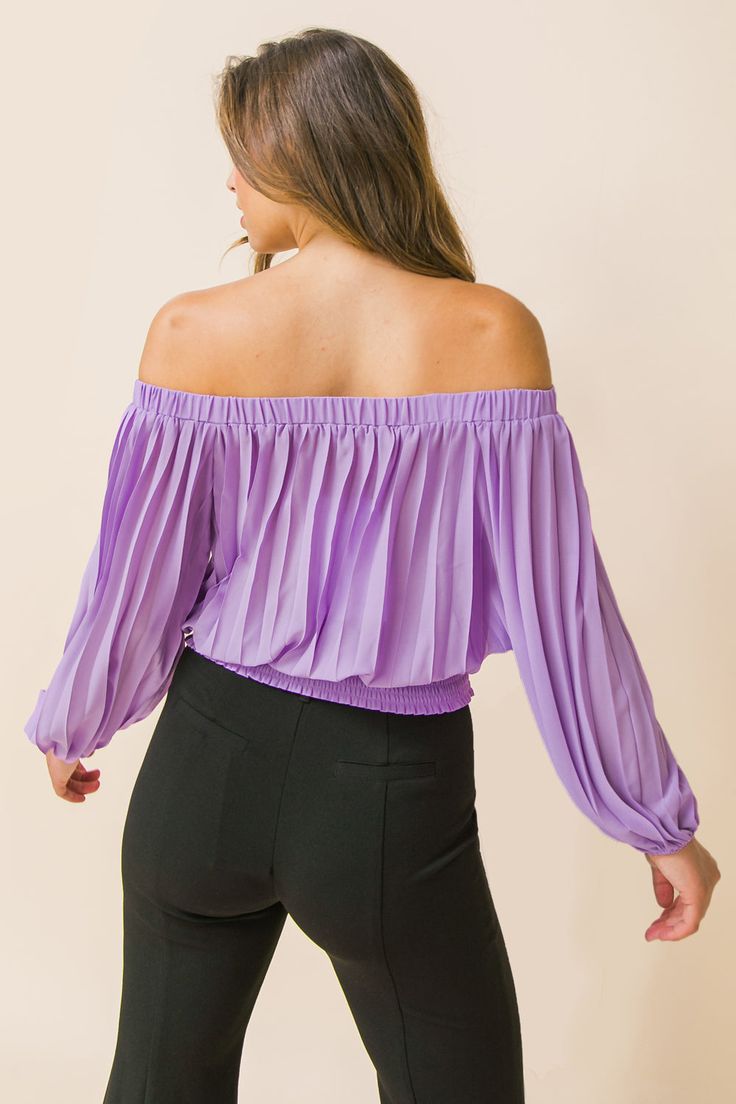 A solid woven top featuring accordion pleats, and elasticized off-the-shoulder neckline, long bishop sleeves, and a wide smocked waistband. Details Self: 100% polyester Size & Fit - Model is 5`8" and wearing size Small - Measurements taken from size Small - Length: 15" Trendy Evening Blouse In Solid Color, Chic Non-stretch Party Top, Trendy Stretch Blouse For Going Out, Purple Tops For Night Out In Spring, Purple Stretch Blouse For Party, Fitted Purple Chic Blouse, Chic Fitted Purple Blouse, Purple Blouse For Fall, Non-stretch Blouse For Night Out