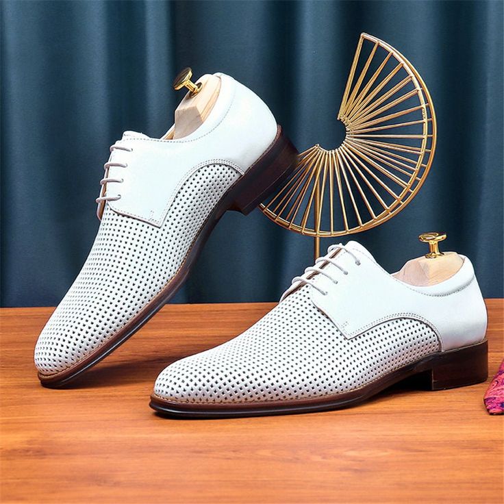 Elevate your style with the LaceLuxe Pointed Toe Wedding Dress Shoes, the epitome of elegance and sophistication. Crafted with genuine cow leather and featuring a solid pattern and pointed toe shape, these brogue shoes make a statement wherever you go. Not only do they look stunning, but they also prioritize comfort with a full grain leather insole and pigskin lining. Dance the night away with the secure lace-up closure and confidently navigate any surface with the durable rubber outsole. Whether you're walking down the aisle or attending a special event, make a lasting impression with these shoes that are sure to turn heads and leave a lasting impression. Fitted Wingtip Lace-up Shoes For Spring, Elegant White Wingtip Lace-up Shoes, White Brogue-detailed Oxfords For Semi-formal Occasions, White Brogue Oxfords For Semi-formal Occasions, White Oxfords With Brogue Detailing For Semi-formal Occasions, Semi-formal White Oxfords With Brogue Detailing, Elegant Leather Lace-up Shoes For Spring, Elegant Oxfords With Perforated Almond Toe, Summer Business Oxfords With Brogue Detailing