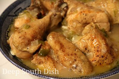 a close up of a bowl of food with chicken and broccoli in it