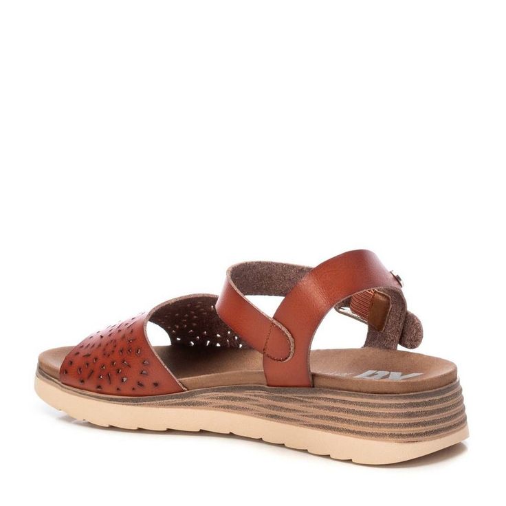 Elevate your summer style with Xti sandals for women. Experience the perfect blend of comfort and fashion with our trendy and high-quality designs. These stylish shoes are the perfect blend of fashion and function. Manufactured with the highest quality materials, they are built to last. The comfort level of these shoes is unmatched, providing all-day support for your feet. Brown Footbed Sandals With Arch Support For Spring, Brown Summer Sport Sandals With Arch Support, Brown Wedge Sandals With Arch Support For Spring, Brown Sport Sandals With Arch Support For Summer, Comfortable Brown Synthetic Slingback Sandals, Brown Sport Sandals For Spring Beach Occasion, Brown Sandals With Ortholite Insole, Brown Wedge Sandals With Ortholite Insole For Summer, Summer Brown Wedge Sandals With Ortholite Insole