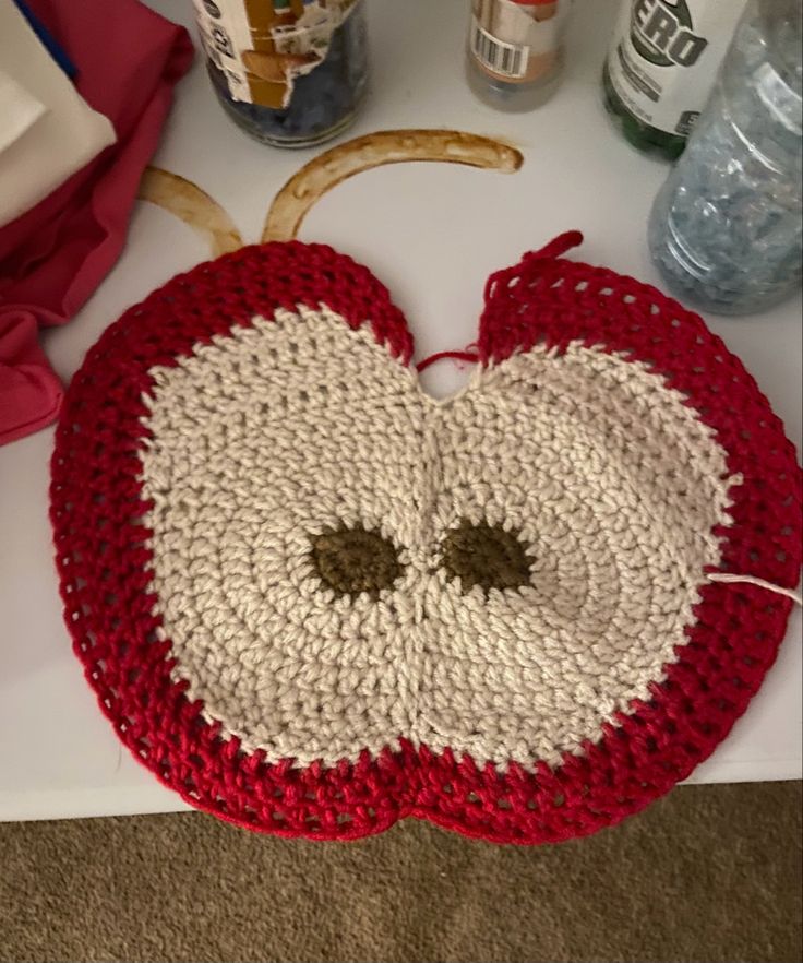 a crocheted apple sitting on top of a counter