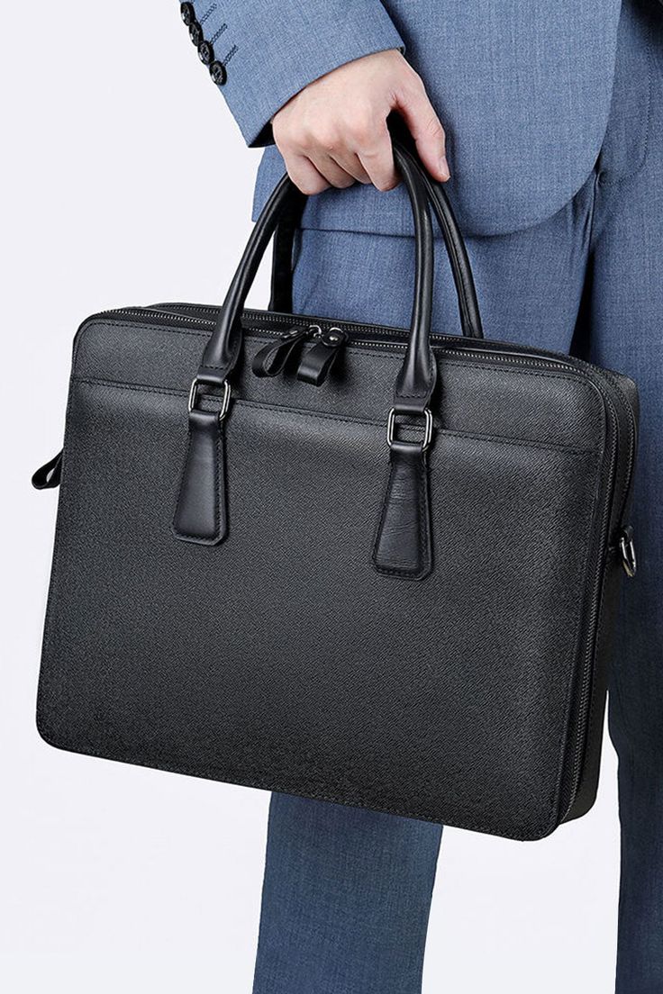 Introducing the Genmarks Deluxe Office Bag - the epitome of sophistication and practicality. Made with premium full-grain real leather, this office bag is built to last and exude a sense of elegance. The sleek and professional design of the bag makes it perfect for carrying all your work essentials, whether you're heading to the office or a business meeting. The spacious interior and multiple compartments allow you to keep your documents, laptop, and other essentials organized and easily accessi Tote Briefcase With Top Carry Handle For Business Trips, Tote-shaped Briefcase With Top Carry Handle For Business Trips, Business Trip Briefcase With Top Carry Handle, Business Trips Tote Briefcase With Top Carry Handle, Professional Leather Satchel For Work, Professional Leather Shoulder Bag For Work, Professional Rectangular Leather Bag, Business Briefcase With Top Carry Handle, Timeless Bag With Top Carry Handle For Business Trips