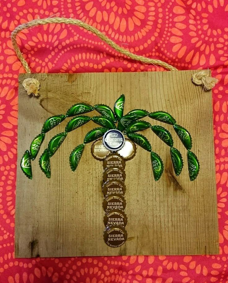 a wooden plaque with a palm tree on it