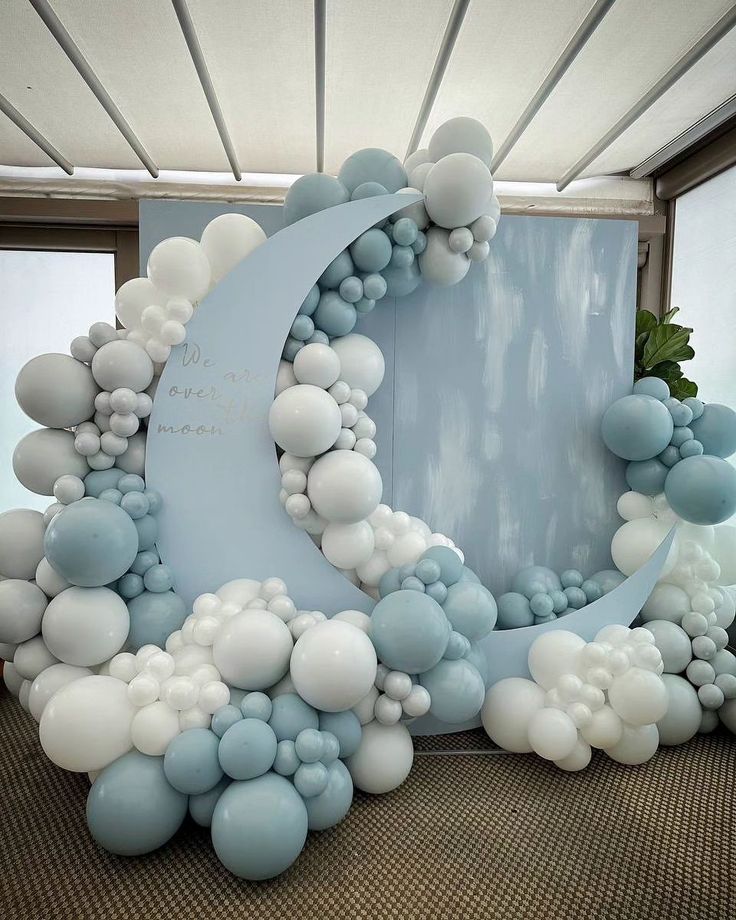 an arch made out of balloons with a crescent