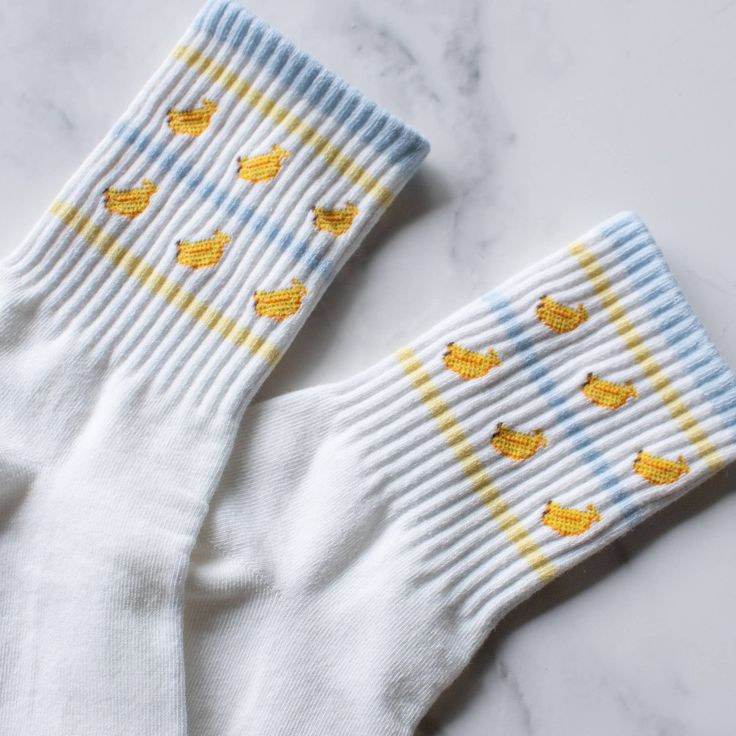 Adult Size 80% Cotton ,10% Spandex, 10%Polyester Machine Wash Introducing our Juicy Fruit Casual Socks, designed for comfort and style. These socks feature playful lines that add a pop of fun to any outfit. Made with quality materials, they offer a snug fit and long-lasting durability. Elevate your sock game with our Juicy Fruit Casual Socks. Novelty Cotton Socks For Winter, Novelty Cotton Winter Socks, Winter Novelty Cotton Socks, Fun Cotton Winter Socks, Fun Winter Cotton Socks, Fun Yellow Cotton Socks, White Novelty Socks For Winter, Playful White Cotton Socks, Novelty White Socks For Winter