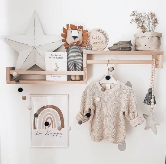 there is a baby's room with toys on the shelf and other items hanging