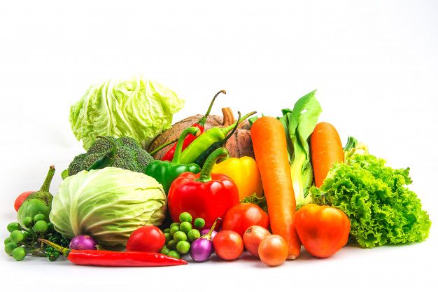 a pile of fresh vegetables sitting on top of each other in front of a white background