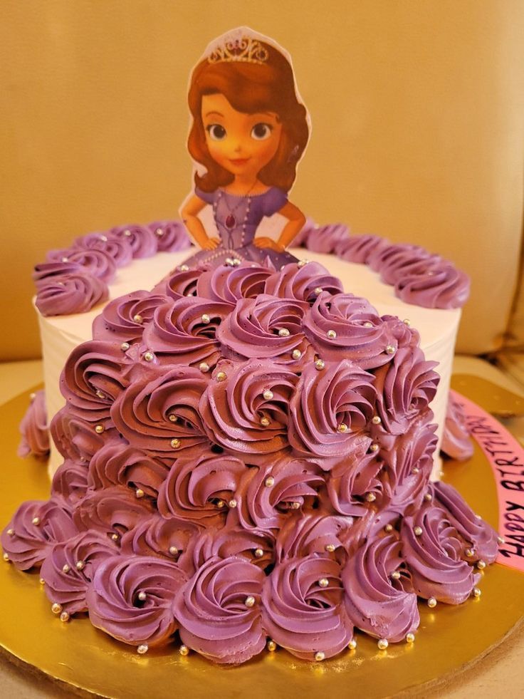 a princess cake with purple frosting on top