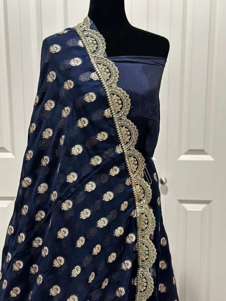 Such a gorgeous Banarsi Georgette saree with designer gotta Patti weaving is shindig ready , refreshing and unique . Get closer and look at the detailing of this impeccable work . Luxury , beauty and style comes alive altogether in this beautiful piece. This saree is ready to wear with fall, pico and unstitched blouse fabric is included. color- midnight blue / gold zari Note: Colors that show up on your screen may vary slightly from the actual product due to variations in settings. Also, the act Festive Blue Anarkali Set With Gota Work, Blue Bollywood Anarkali Set With Gota Work, Blue Raw Silk Dupatta With Gota Work, Blue Chanderi Traditional Wear With Gota Work, Eid Anarkali Pre-draped Saree With Gota Work, Diwali Silk Pre-draped Saree With Gota Work, Festive Pre-draped Saree With Gota Work, Designer Chanderi Pre-draped Saree With Gota Work, Designer Pre-draped Dola Silk Saree With Dupatta