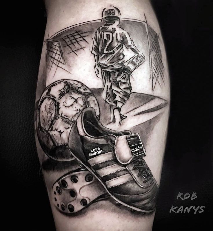 a man's leg with a black and white tattoo on it, depicting a basketball player