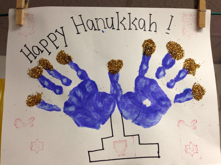 a handprint is hanging on a clothesline with the words happy hanukkah