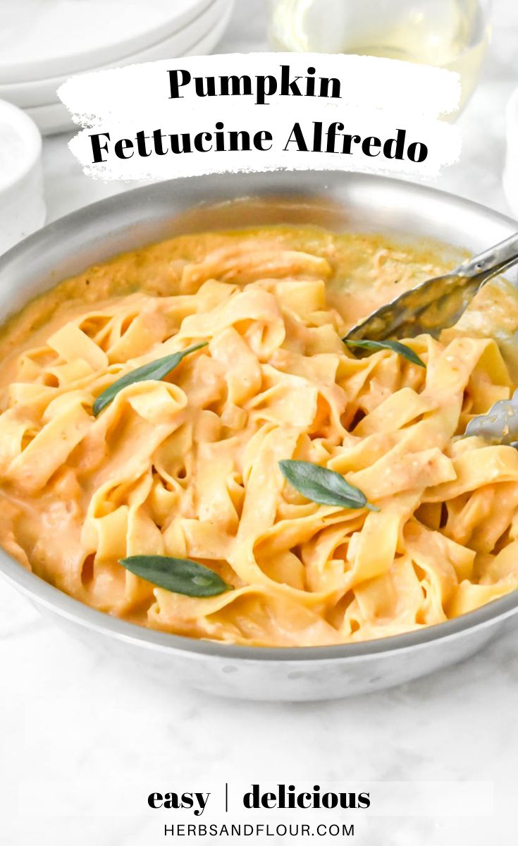 pumpkin fettuccine alfredo in a silver bowl with a spoon on the side