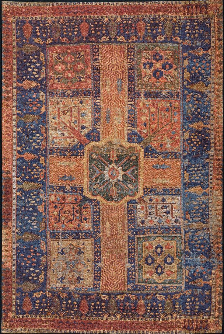 an orange, blue and yellow rug with many different designs on it's sides