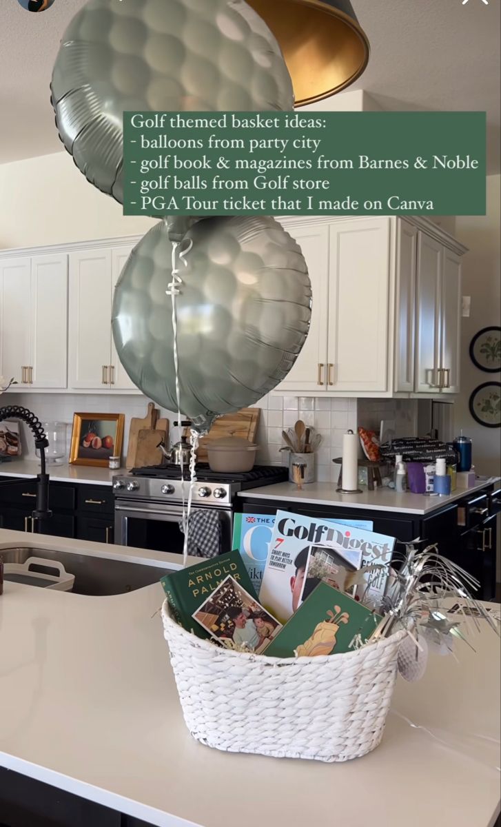 a kitchen with balloons and magazines hanging from the ceiling in it's center island