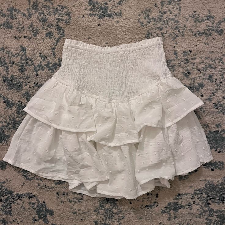 White Smocked Mini Skirt. Never Worn. New Condition. Summer Tiered Skirt With Smocked Back, Trendy White Skirt With Ruffle Hem, Chic Smocked Back Skirt For Spring, Summer Skirt With Smocked Back For Day Out, Chic Spring Skirt With Smocked Back, Brunch Tiered Skirt With Smocked Back, Summer Day Out Skirt With Smocked Back, Summer Flowy Skirt With Smocked Back, Spring Skirt With Smocked Back