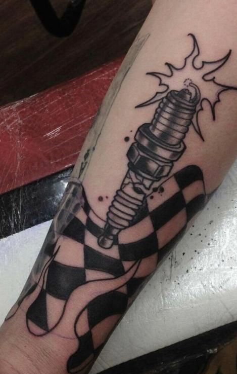 a black and white tattoo with a checkered flag on it