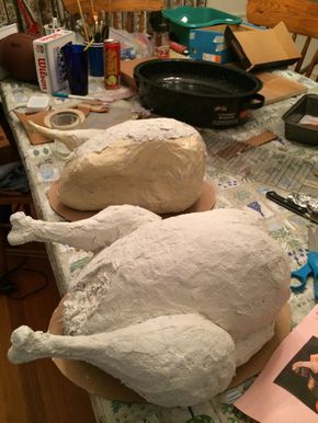 a large white turkey sitting on top of a table