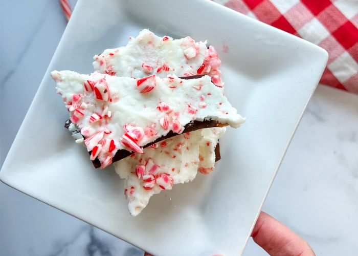 a white plate topped with pieces of cake covered in candy canes