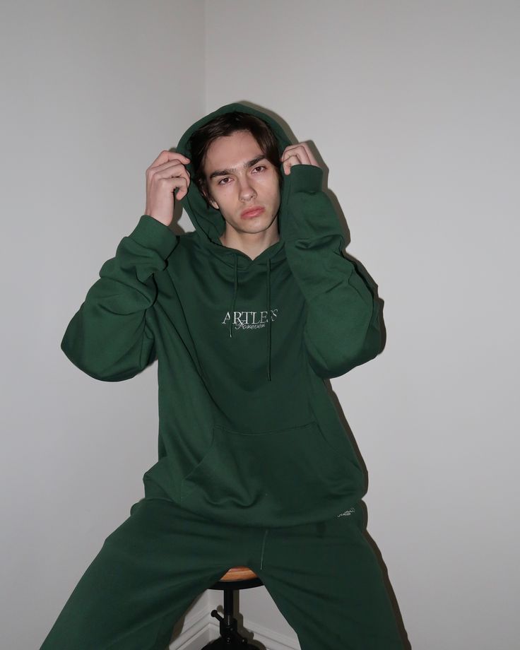 Premium unisex loungewear has arrived. Made with 100% cotton French terry. Unisex fit. Fits true to size. Features embroidery on front and screen print circle graphic on back. Note: this product may shrink in the dryer. We recommend sizing up if you plan to dry your garment. Sporty Green Hoodie With Embroidered Logo, Green Sporty Hoodie With Embroidered Logo, Relaxed Fit Green Top With Embroidered Logo, Green Relaxed Fit Top With Embroidered Logo, Green Sweatshirt With Embroidered Logo For Streetwear, Oversized Green Athleisure Sweats, Green Urban Hoodie With Relaxed Fit, Green Cotton Sweatshirt For Streetwear, Green Relaxed Fit Urban Hoodie