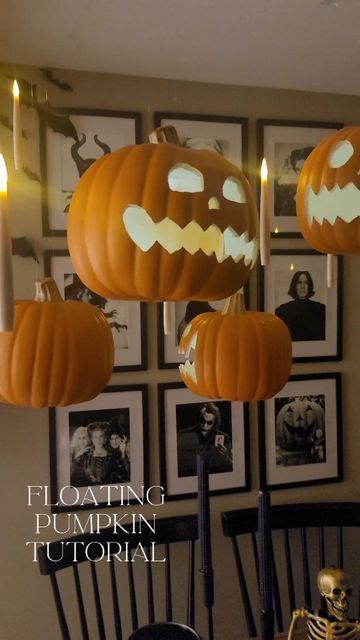 halloween decorations hanging from the ceiling in a dining room