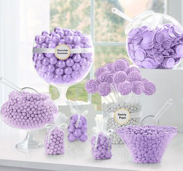 purple and white candies are displayed in front of a window