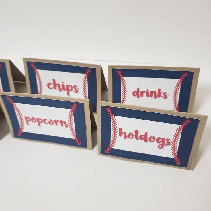 three cards with the words chips, drinks and baseballs printed on them are sitting next to each other