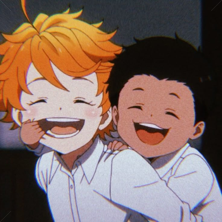 two young boys are hugging each other in front of a screen with an anime character