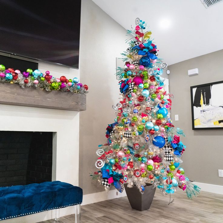 a brightly colored christmas tree in a living room