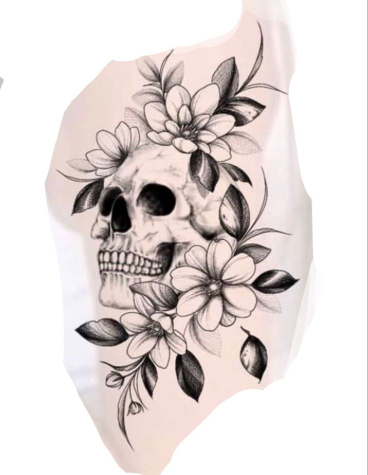 a skull with flowers and leaves on it