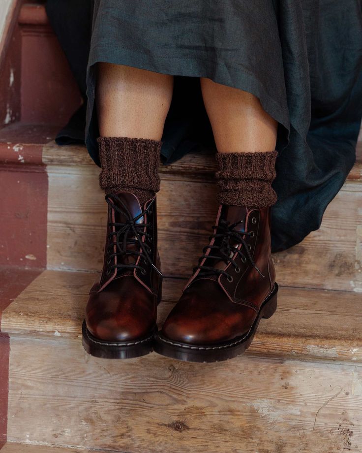 A quality leather lace up boot, crafted in England in a burgundy 'rub off' high shine leather, giving a two tone vintage effect. Constructed with a Goodyear welted, soft suspension sole. These boots are built to last and are the perfect winter boot, lasting for many years to come.Please see the 'Sizing' description below. SIZING We find these boots to run quite big. For standard size feet, we recommend sizing down by half a size. For narrow feet, size down a full size. For wide feet, go with you Leather Boots Reference, Solovair Astronaut Boots, Vintage Winter Shoes, Vintage Boots Aesthetic, How To Style Winter Boots, Solovair Boots Outfit, Dark Academia Boots, Vintage Boots Outfit, Winter Boots Aesthetic