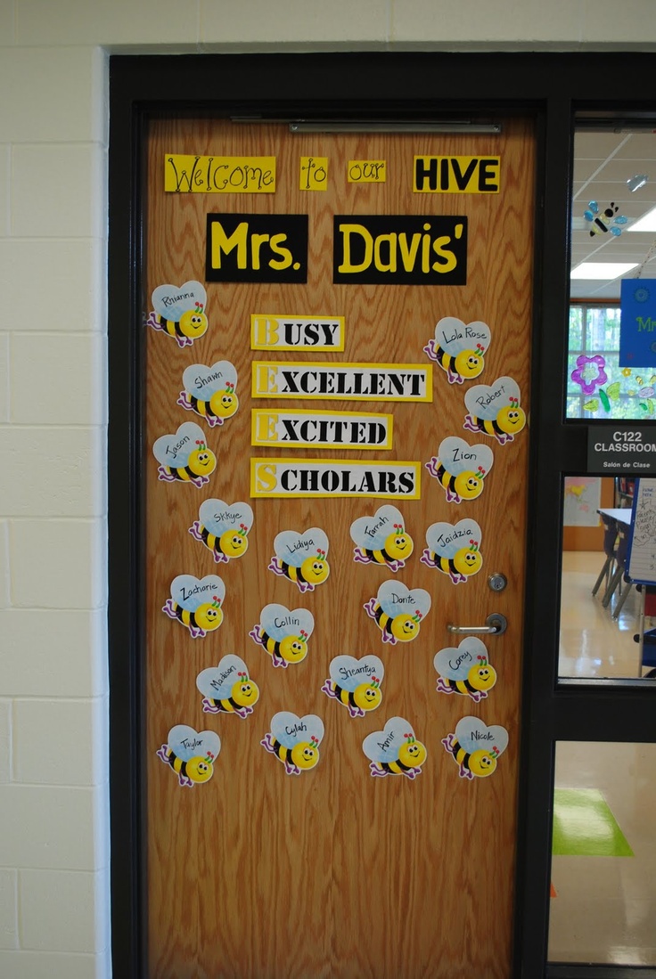 a door decorated with stickers and magnets for the school's classroom doors