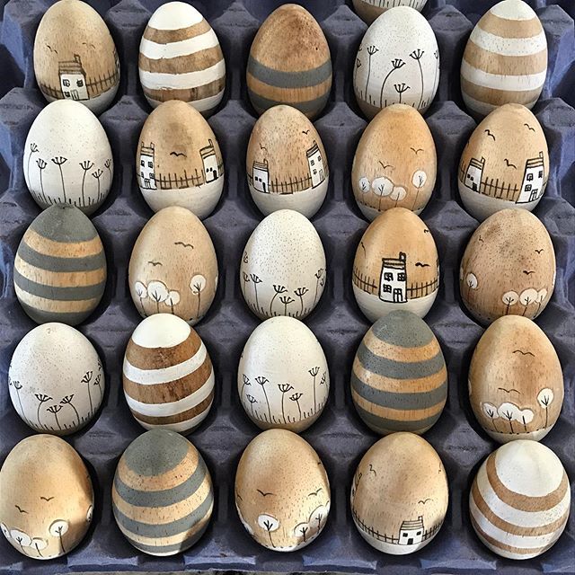 an egg carton filled with lots of painted eggs