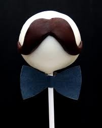 a close up of a lollipop with a bow tie on it