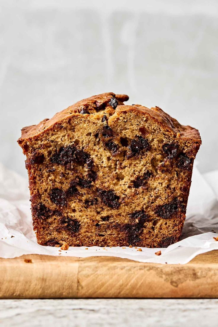 a close up of a muffin on a cutting board