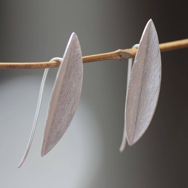 The natural beauty of bamboo leaves inspires the minimalist design of these earrings by Desi Antari. She works with sterling silver crafting the stunning drop earrings with a brushed satin finish. .925 Sterling silver Leaves Earrings, Bamboo Leaves, Sterling Silver Drop Earrings, Nature Inspired Jewelry, Modern Earrings, Silver Drop Earrings, Bijoux Diy, Jewelry Packaging, Leaf Earrings