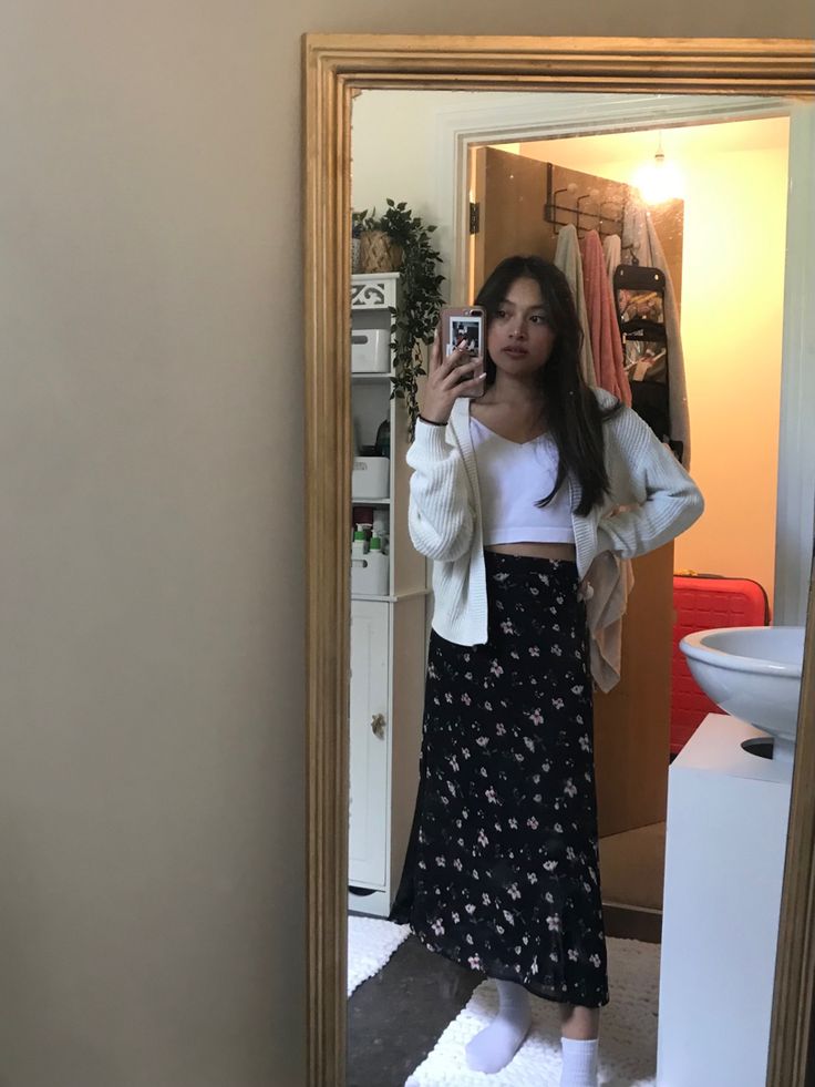 Midi Skirt Outfit Cardigan, Floral Skirt And Cardigan Outfit, Floral Midi Skirt Outfit Aesthetic, White Floral Midi Skirt Outfit, Midi Skirt With Cardigan Outfit, Cardigan Long Skirt Outfit, Floral Maxi Skirt Outfit Fall, Long Skirt And Cardigan Outfit, White Cardigan Outfit Aesthetic