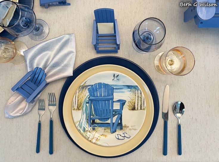 a place setting with blue chairs and silverware