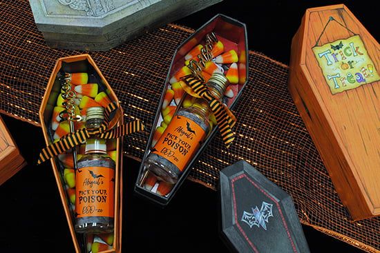 an assortment of halloween candy in wooden boxes